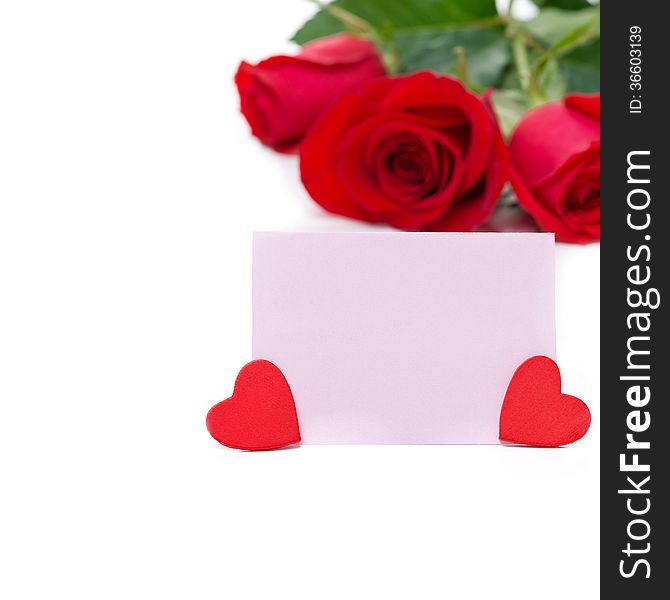 Pink card for greetings, hearts and red roses, isolated on white