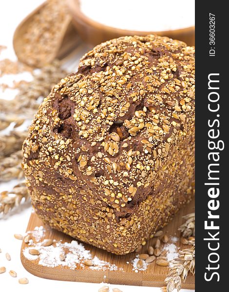 Whole grain bread with seeds, close-up, vertical