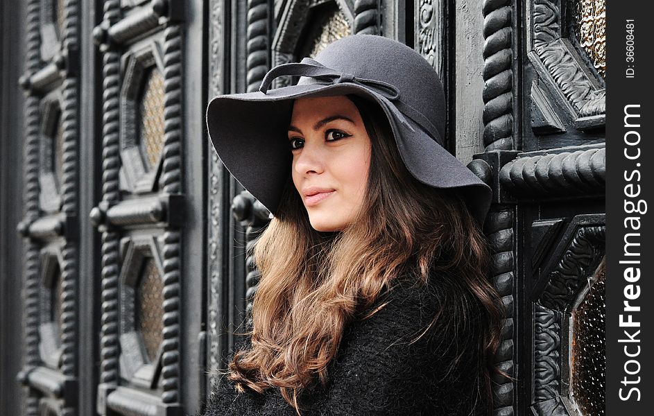 Smiling girl. Portrait of elegant brunette woman with hat. Smiling girl. Portrait of elegant brunette woman with hat.