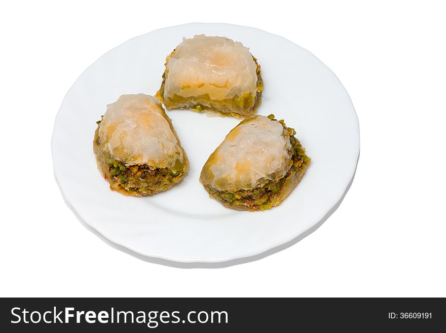 Plate with turkish baklava isolated over white background