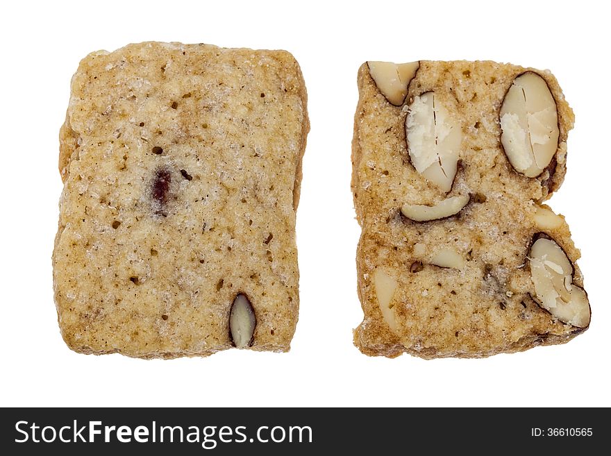 Biscuit with seeds and jam isolated against a white background.