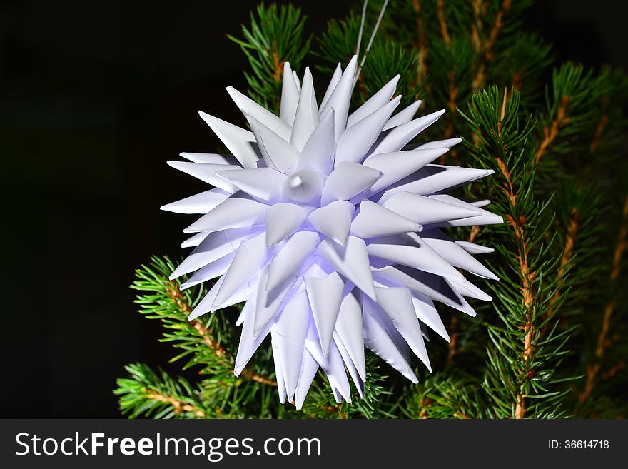 White folded paper of star shape in Christmas tree