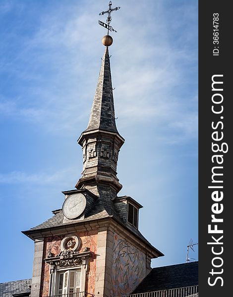 Church steeple in madrid against a blue sky