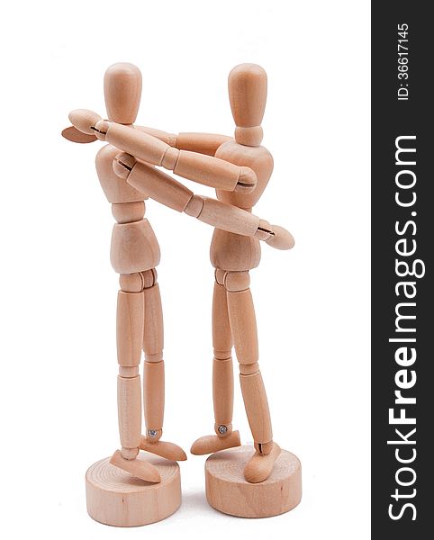 Wooden model couple embrace. Wooden model couple embrace.