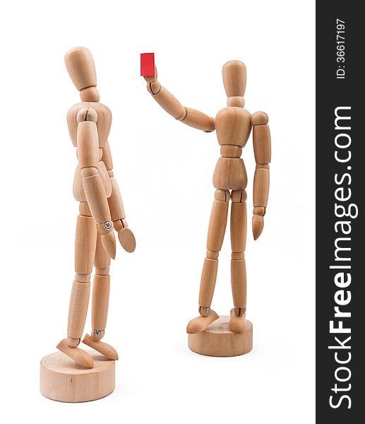 Wooden player receiving red card.