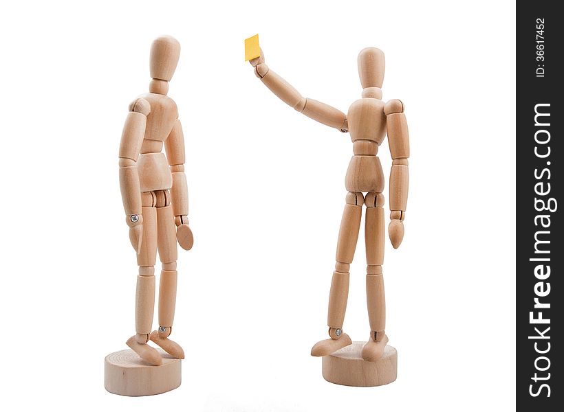 Wooden referee shows yellow card to player.