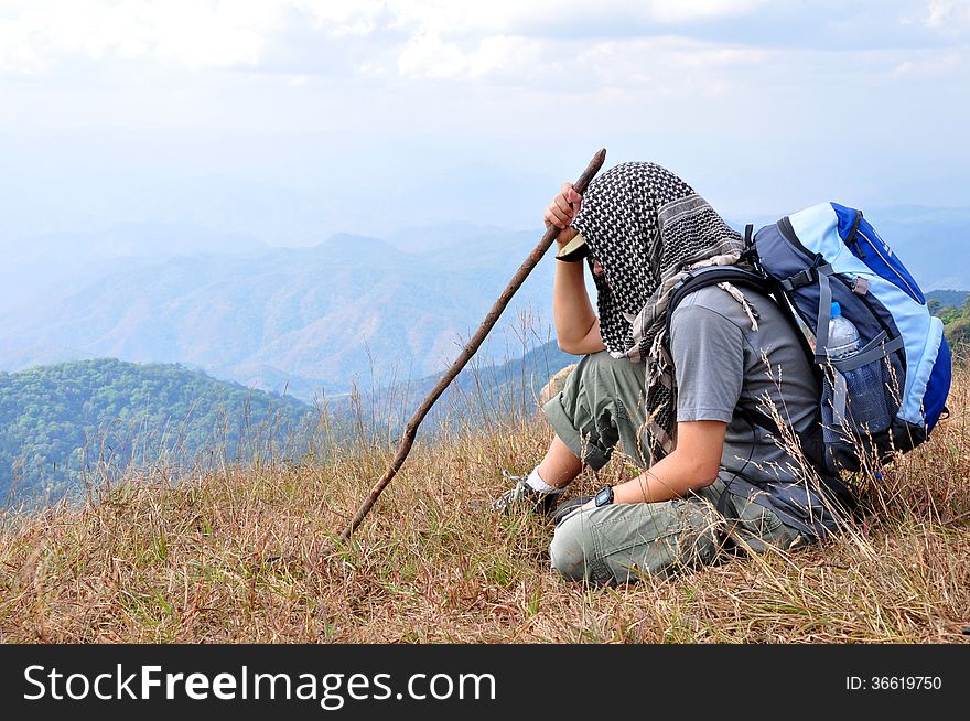 Traveler resting during a trip on the mountain.