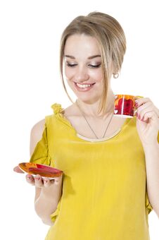 Woman With Cup Of Coffee On A Plate Royalty Free Stock Images