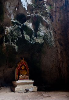 A Sitting Golden Buddha In The Cave In Thailand Royalty Free Stock Photography A Sitting Golden Buddha In The Cave In Thailand Royalty Free Stock Photography