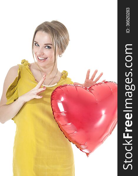 Funny woman holding red heart balloon.
