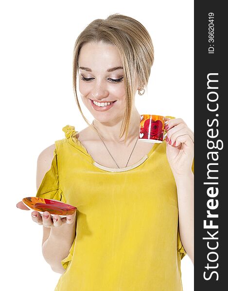 Smiling woman with cup of coffee on a plate, isolated on white background.