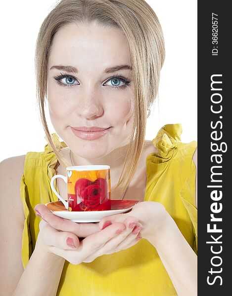 Dreamy woman offering a cup of coffee on a plate, isolated on white background.