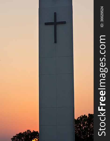 Church steeple with cross at sunset. Church steeple with cross at sunset