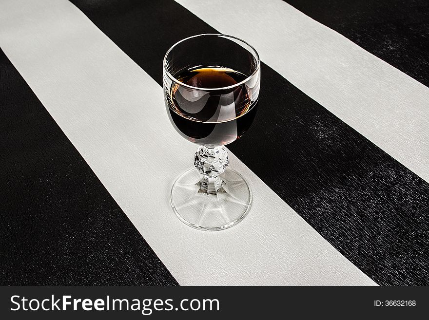 Glass of brandy on the original background