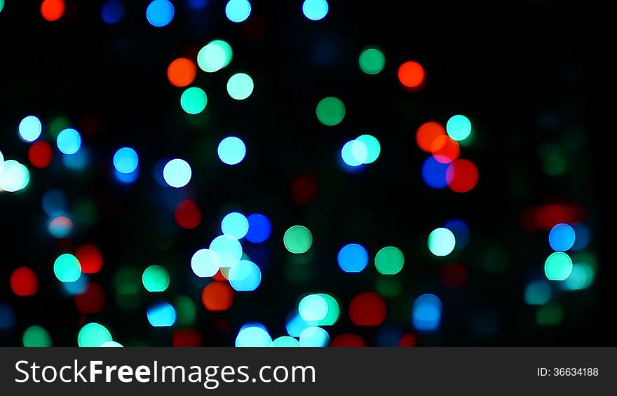 Video of Christmas lights with different color out of focus