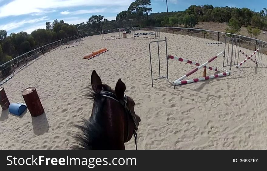 Horse riding POV going over jump