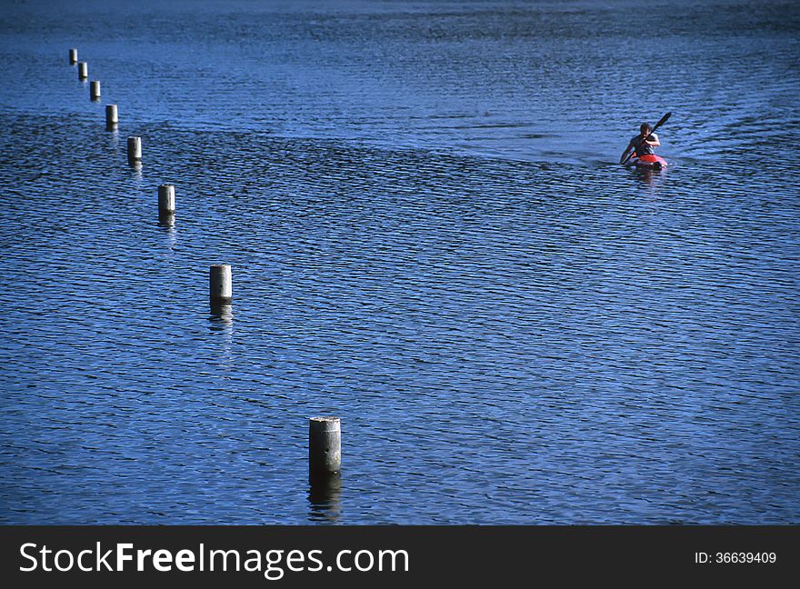 A lone kayaker on Wentworth Falls Lake. A lone kayaker on Wentworth Falls Lake