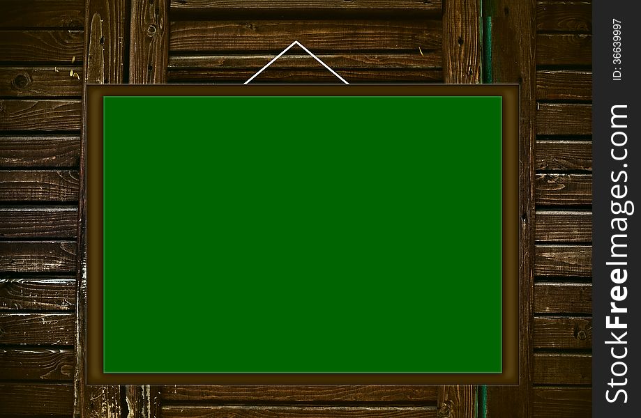 Blank Green Board On Wooden Background