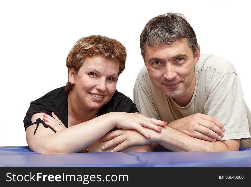 Charming couple posing in their living room. Charming couple posing in their living room