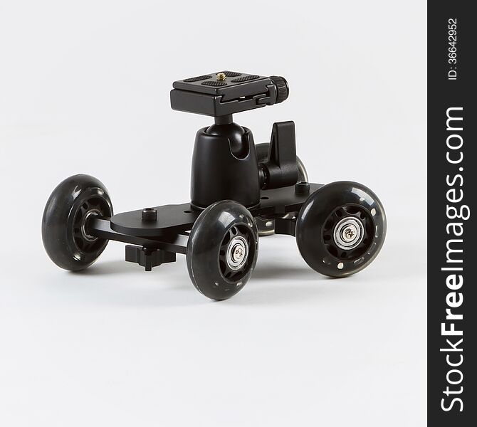 A studio shot of a camera skater dolly on a white background. A studio shot of a camera skater dolly on a white background.