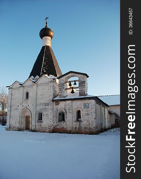 Photo of the Kirillo-Belozersky monastery in a winter landscape at sunset. Vologda region, Russia. Photo of the Kirillo-Belozersky monastery in a winter landscape at sunset. Vologda region, Russia.