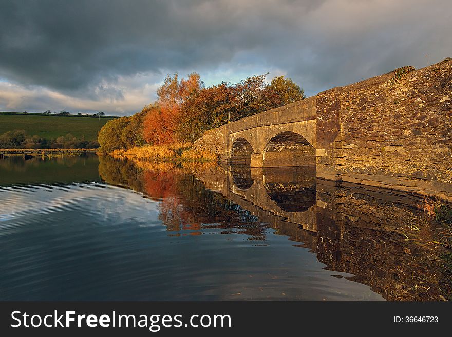 Brilliant sunlight illuminates stone bridge in Lee Valley, Co.Cork. Brilliant sunlight illuminates stone bridge in Lee Valley, Co.Cork