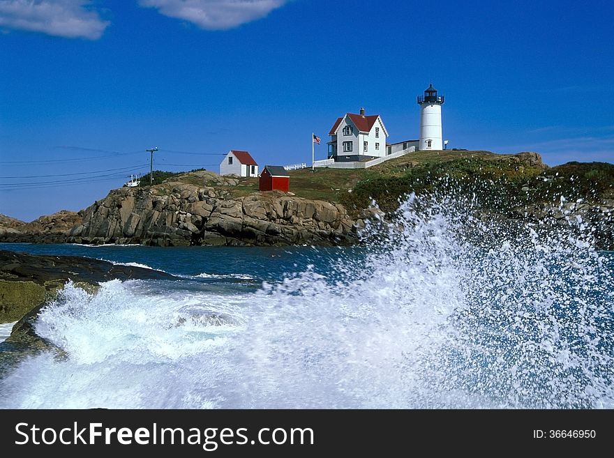 Waves Crashing Around Nubble Lighthouse In Maine