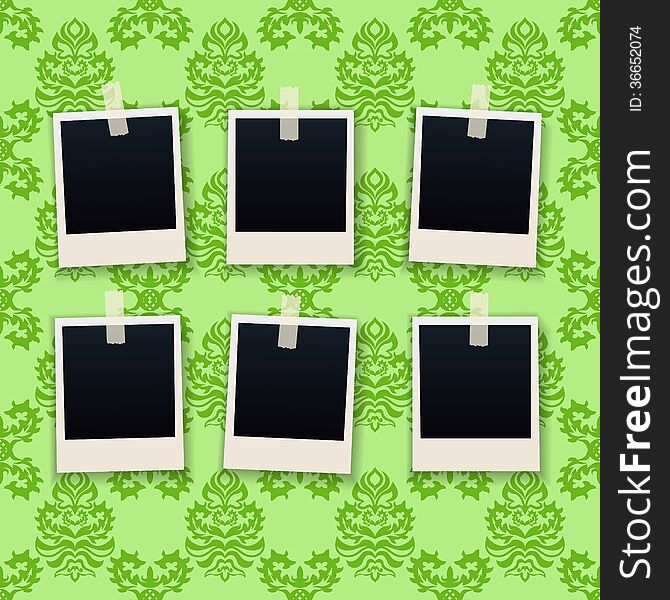 Photo frames on wallpaper background