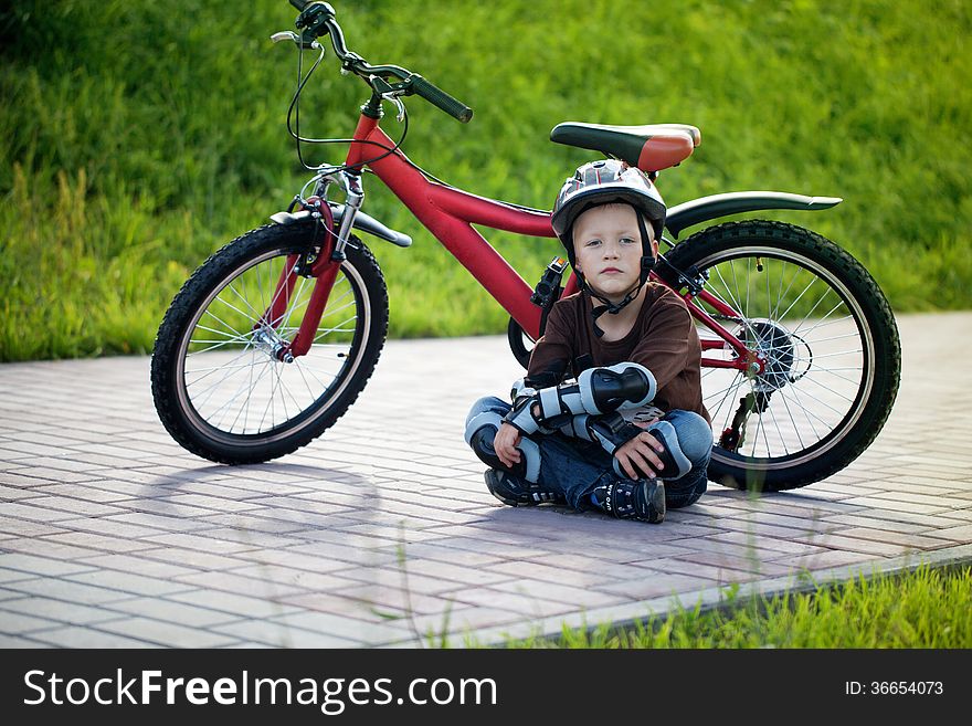 Happy boy cycling at the park