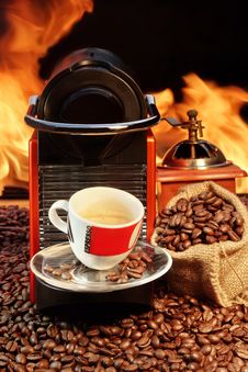 Capsule Coffee Machine With Espresso Cup Near Fireplace Royalty Free Stock Photography Capsule Coffee Machine With Espresso Cup Near Fireplace Royalty Free Stock Photography
