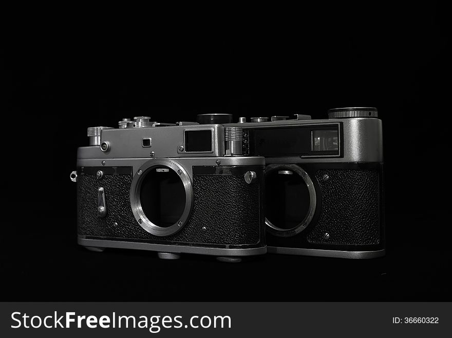 Analog retro photo camera on a dark background. Without lens. Analog retro photo camera on a dark background. Without lens