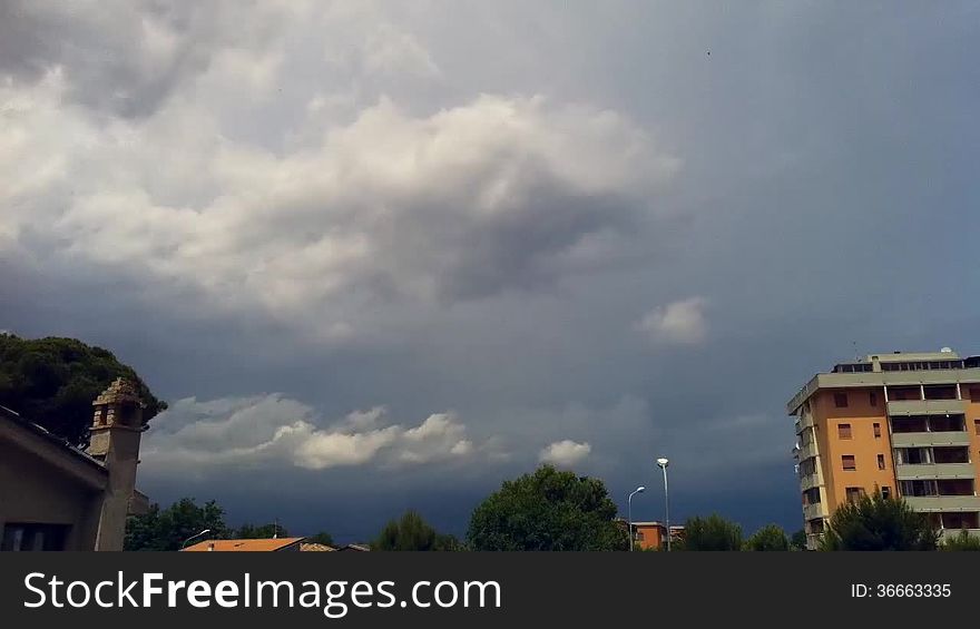 Storm clouds forming over small city timelapsed. Storm clouds forming over small city timelapsed