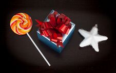 Blue Gift Box, Candycane And White Christmas Star On Black Royalty Free Stock Image Blue Gift Box, Candycane And White Christmas Star On Black Royalty Free Stock Image