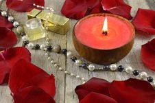Red Candle With Jewelry Stock Image