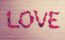 Background Valentine S Day. Word Love Petals Of Red Roses On A W Stock Image Background Valentine S Day. Word Love Petals Of Red Roses On A W Stock Image