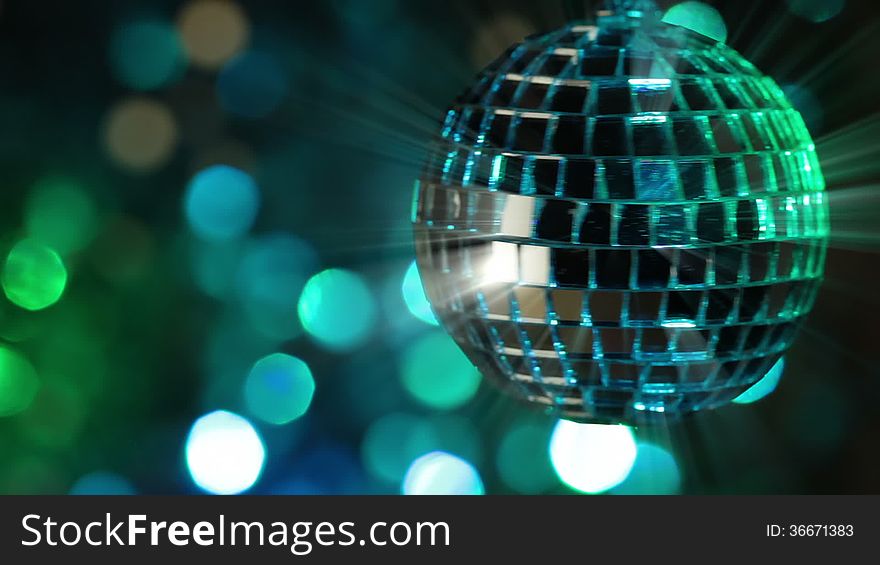 Colorful abstract background. Mirror ball in the foreground. Seamless loop. Colorful abstract background. Mirror ball in the foreground. Seamless loop