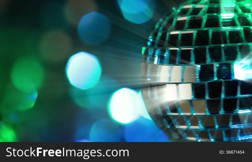 Colorful abstract background. Mirror ball in the foreground. Seamless loop. Colorful abstract background. Mirror ball in the foreground. Seamless loop