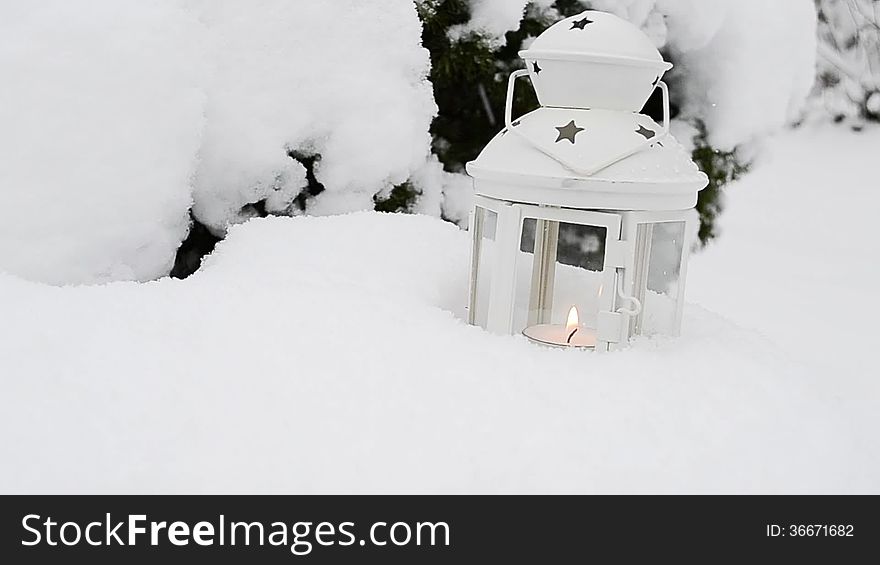 Candle lantern in the snow