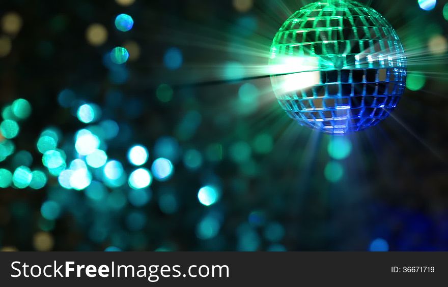 Colorful abstract background. Mirror ball in the foreground. Seamless loop. Colorful abstract background. Mirror ball in the foreground. Seamless loop