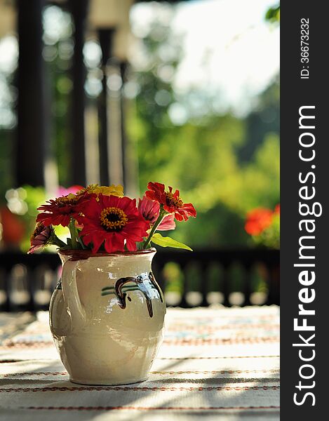 Still life of flowers in vase in a rustic decor