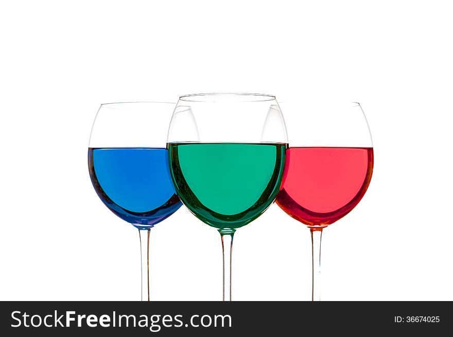 Colorful drinks in wine glasses