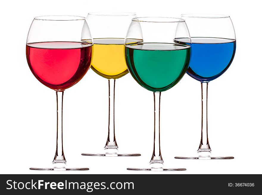 Colorful drinks in wine glasses