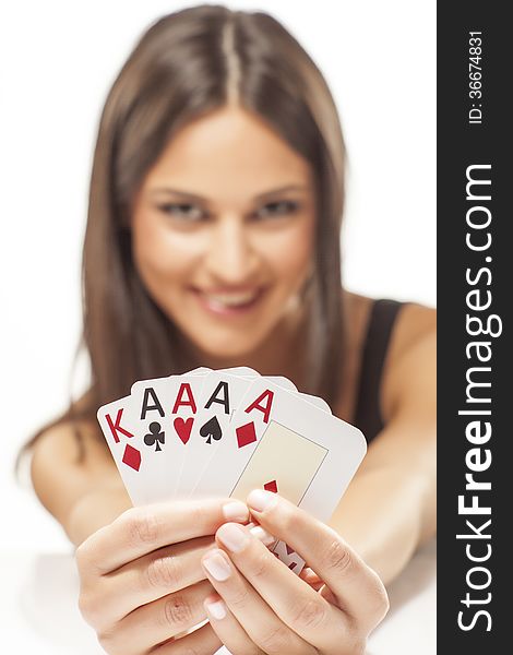 Happy attractive girl holding the winning combination of poker cards. Happy attractive girl holding the winning combination of poker cards