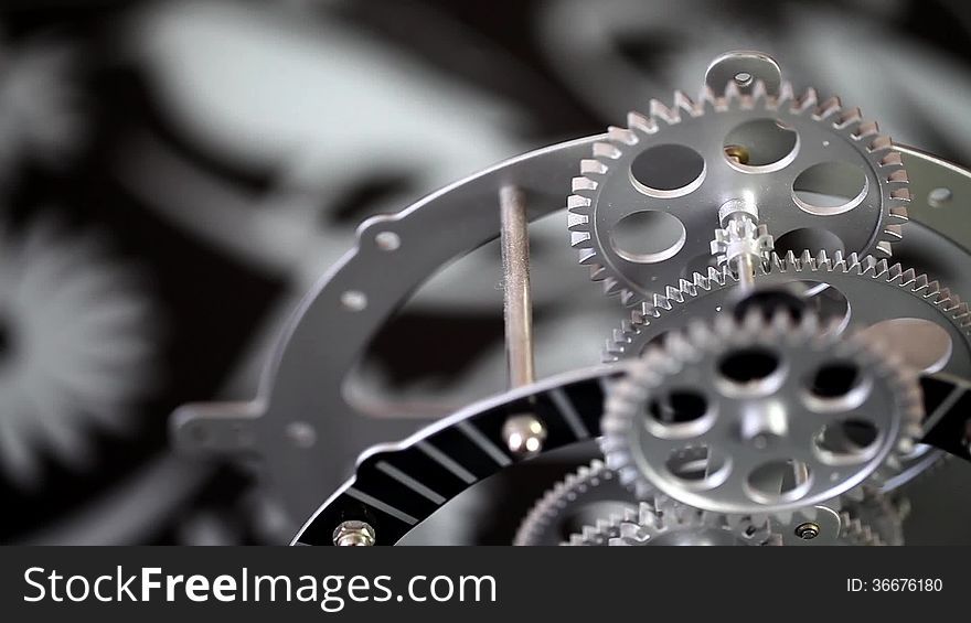 Nice angle of a clock gears. Cinematographic capture.
