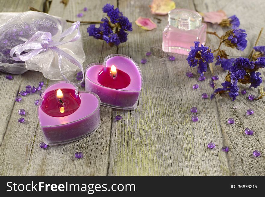 Lilac candles with blue flowers