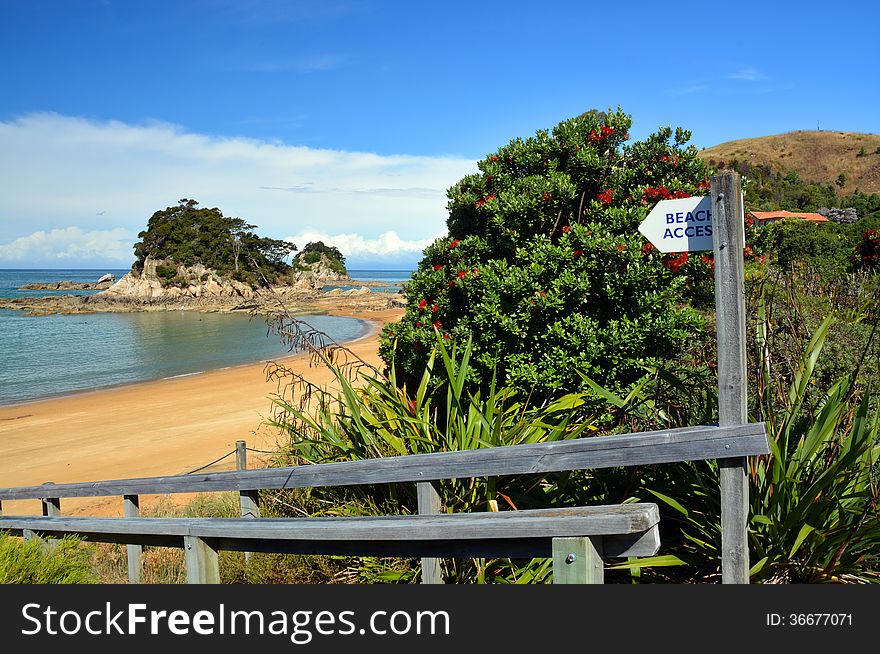 This way to Paradise. Beach access sign at Kaiteriteri Beach, Abel Tasman National Park, New Zealand. This way to Paradise. Beach access sign at Kaiteriteri Beach, Abel Tasman National Park, New Zealand.