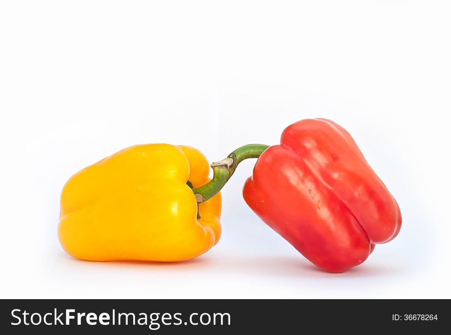 Two peppers on white background