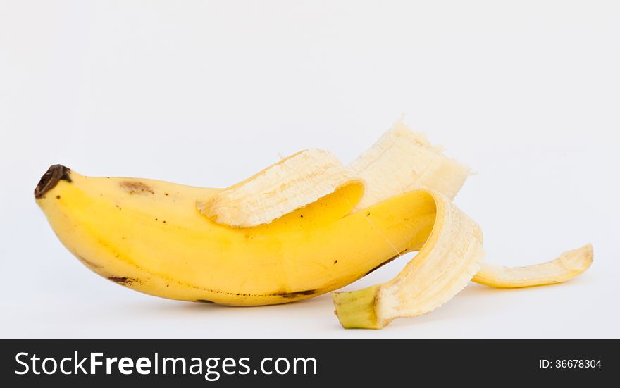 Bited banana on white background