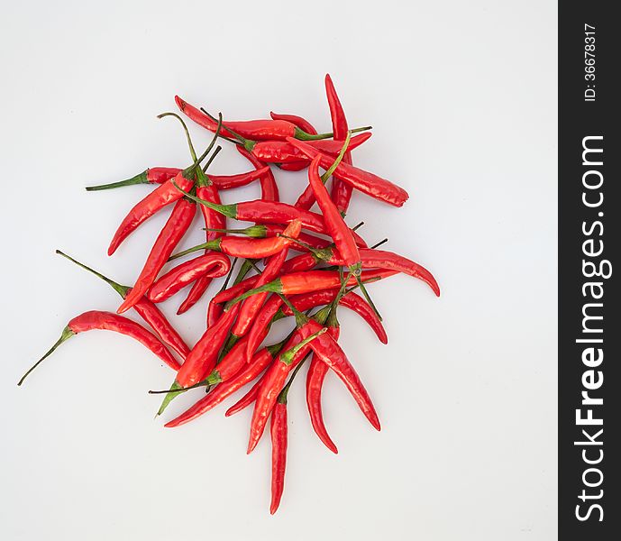 heap of red hot chilli on white background