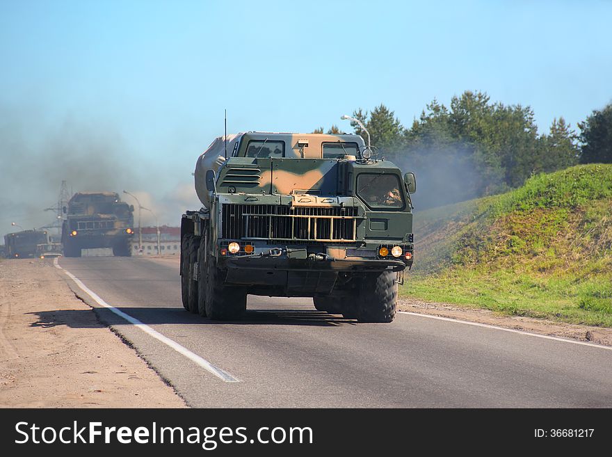 Ensuring the security of the country. Multiple rocket launchers Smerch(Tornado). Missile can hit a target at a distance of 120 kilometers. A column of military vehicles traveling along a mountain road. Ensuring the security of the country. Multiple rocket launchers Smerch(Tornado). Missile can hit a target at a distance of 120 kilometers. A column of military vehicles traveling along a mountain road.